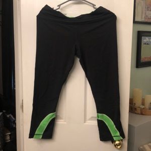 Size 8 Lululemon leggings.  Black and green